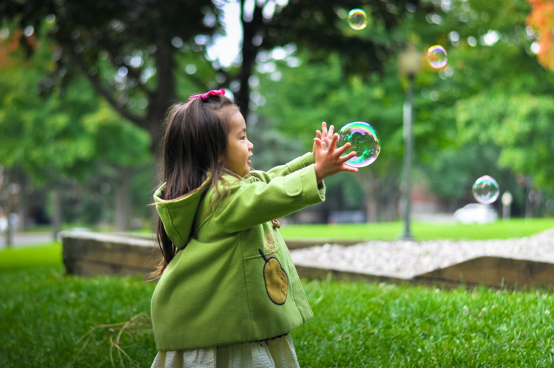 Child playing with bubble